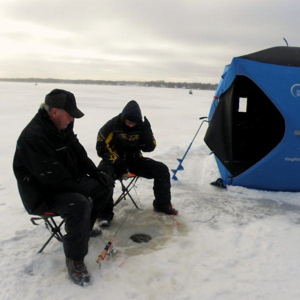 Two people ice fishing on Brereton Lake.
