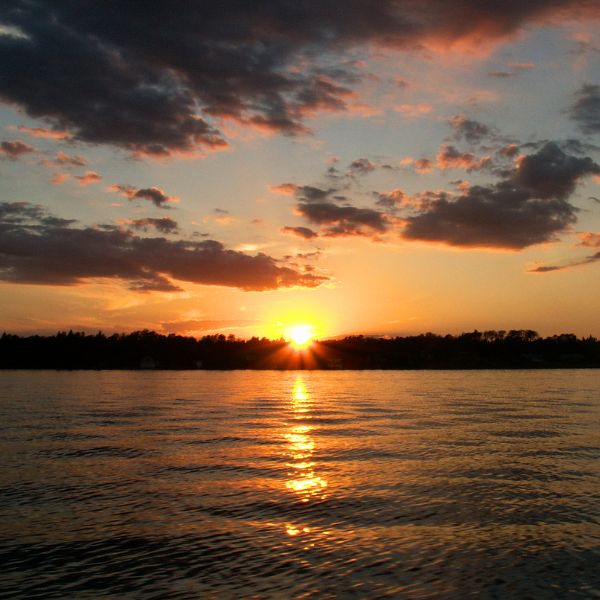 Sunset on the lake, highlighting the gorgeous views people can experience during honeymoon packages.