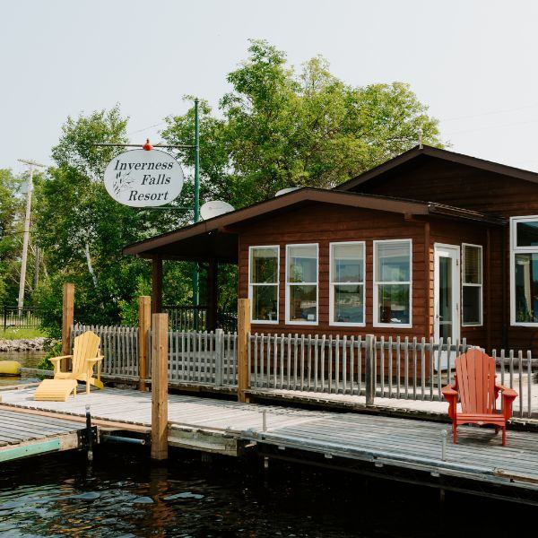Exterior of Inverness Falls Resort's office where the dock starts and people can pull up a patio chair to enjoy the lakeview.