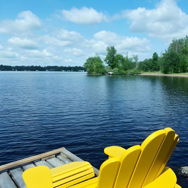 A patio chair on Inverness' dock with a gorgeous view of Brereton Lake.