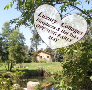Luxury Cottages and Lakeview Cabins with hot tubs are opening in early May. Scenic shot of cottage looking over the stream by the Falls