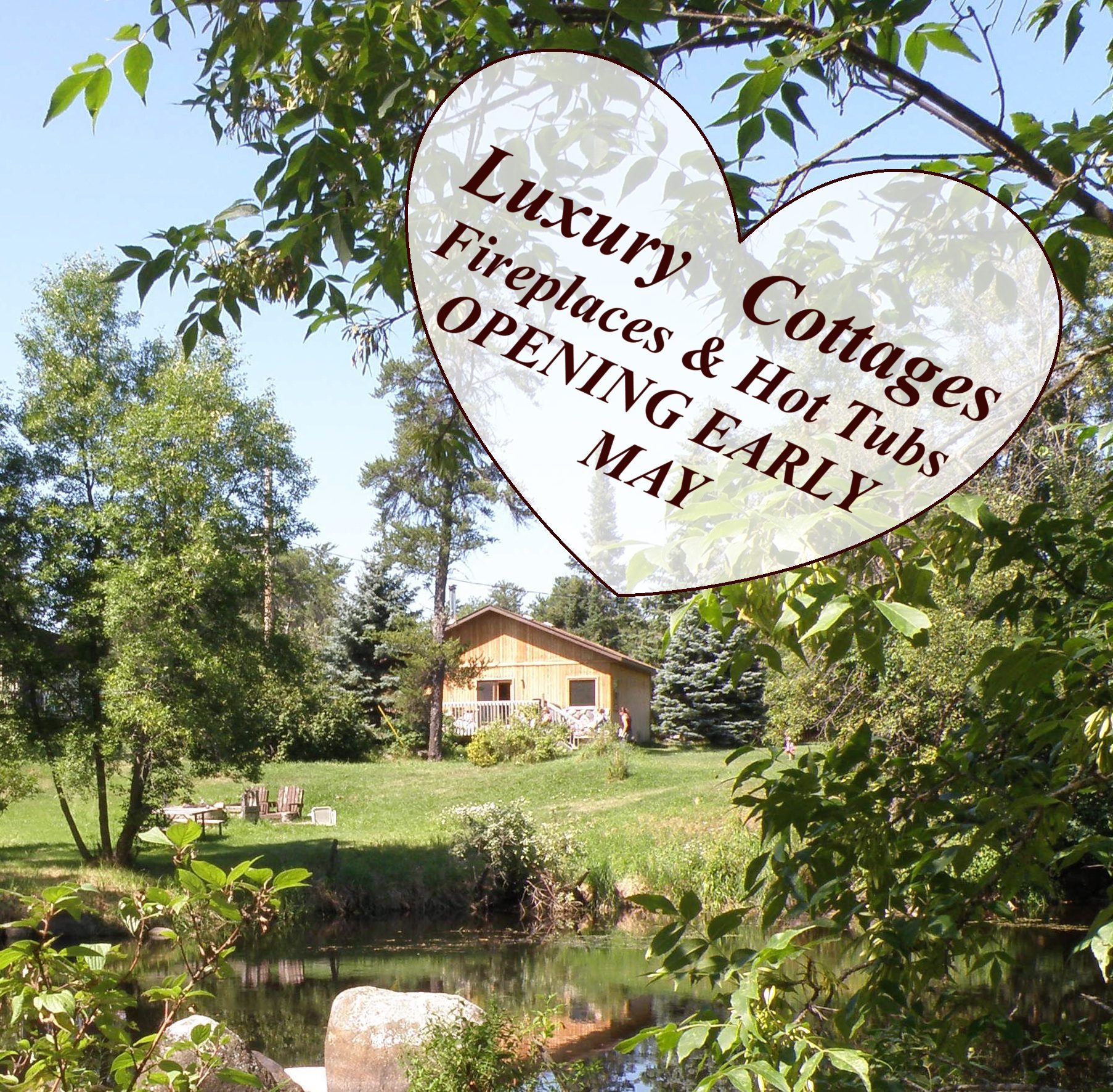 Luxury Cottages and Lakeview Cabins with hot tubs are opening in early May. Scenic shot of cottage looking over the stream by the Falls